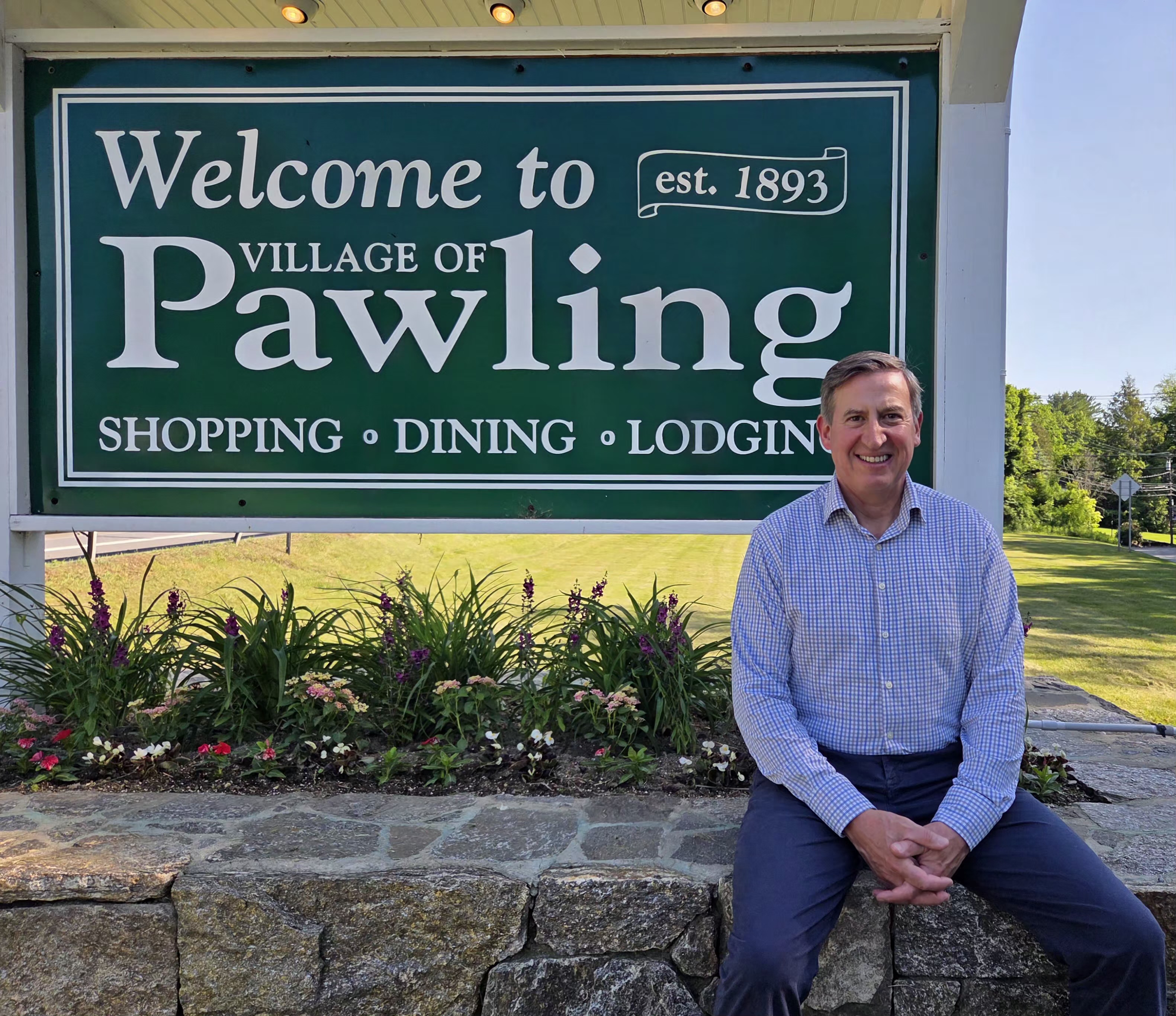 August Uribe next to the Pawling town sign